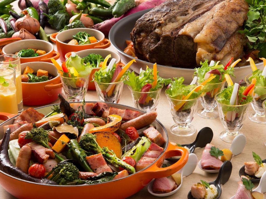 a table topped with a buffet of food at Lake Biwa Otsu Prince Hotel in Otsu