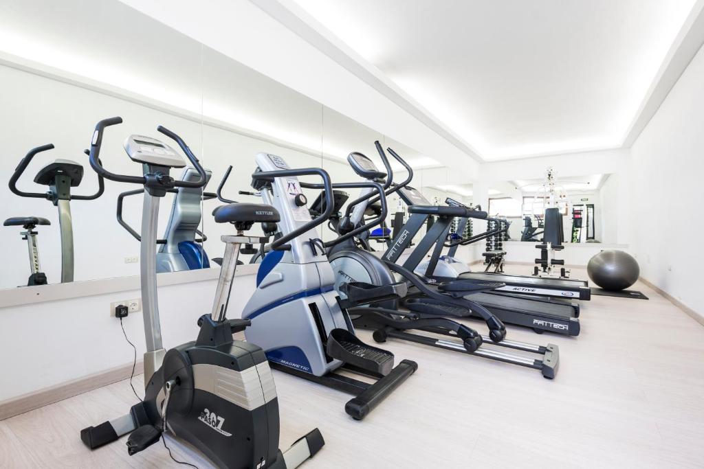 a row of exercise bikes in a gym at Hotel Cala Fornells in Paguera