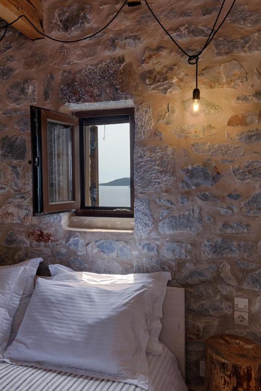 Postel nebo postele na pokoji v ubytování Aegila Boutique Hotel