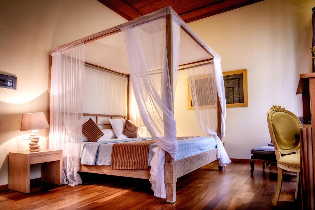 Postel nebo postele na pokoji v ubytování Leo Hotel