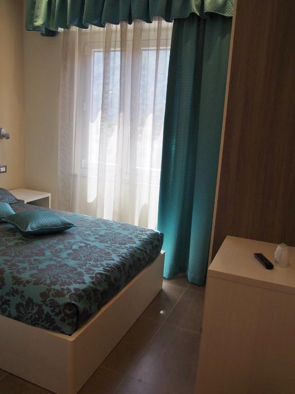 Postel nebo postele na pokoji v ubytování Endro's Rooms