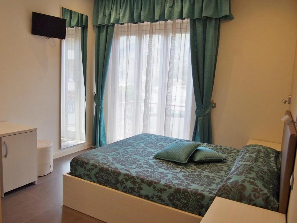 Postel nebo postele na pokoji v ubytování Endro's Rooms