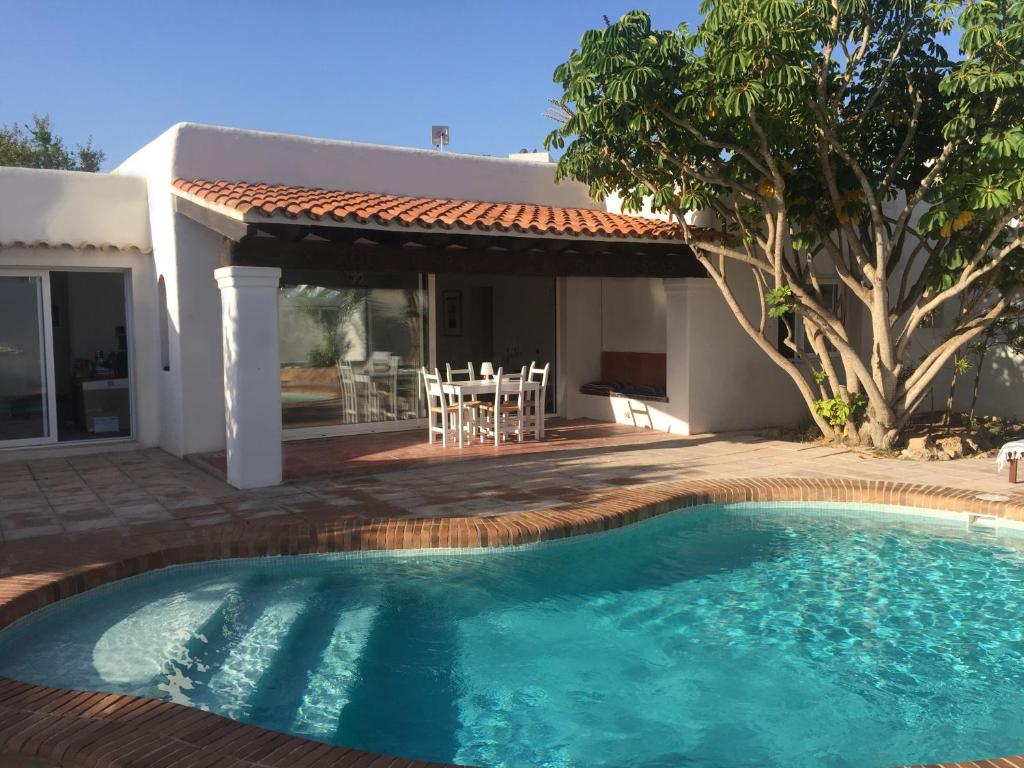 a small swimming pool in front of a house at Can Fuentes in Cala Vadella