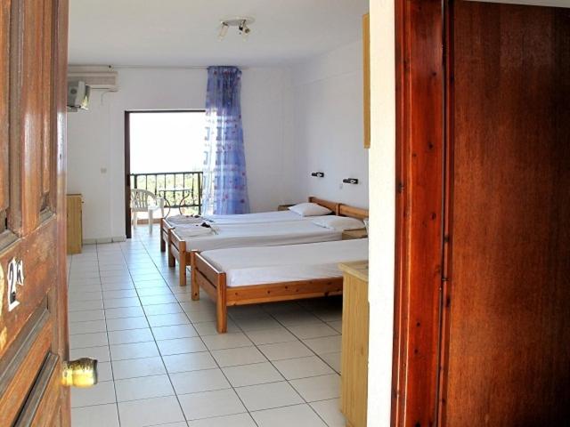 Postel nebo postele na pokoji v ubytování Skentos Hotel