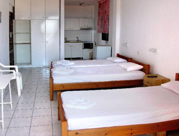 Postel nebo postele na pokoji v ubytování Skentos Hotel
