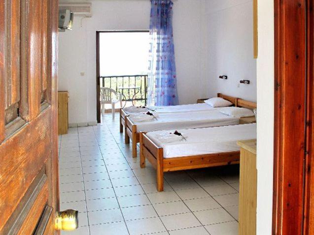Postel nebo postele na pokoji v ubytování Skentos Hotel