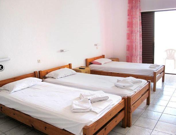 Postel nebo postele na pokoji v ubytování Skentos Hotel