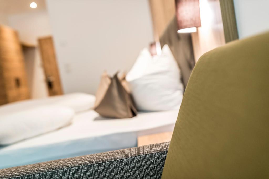 Postel nebo postele na pokoji v ubytování Hotel Rosengarten