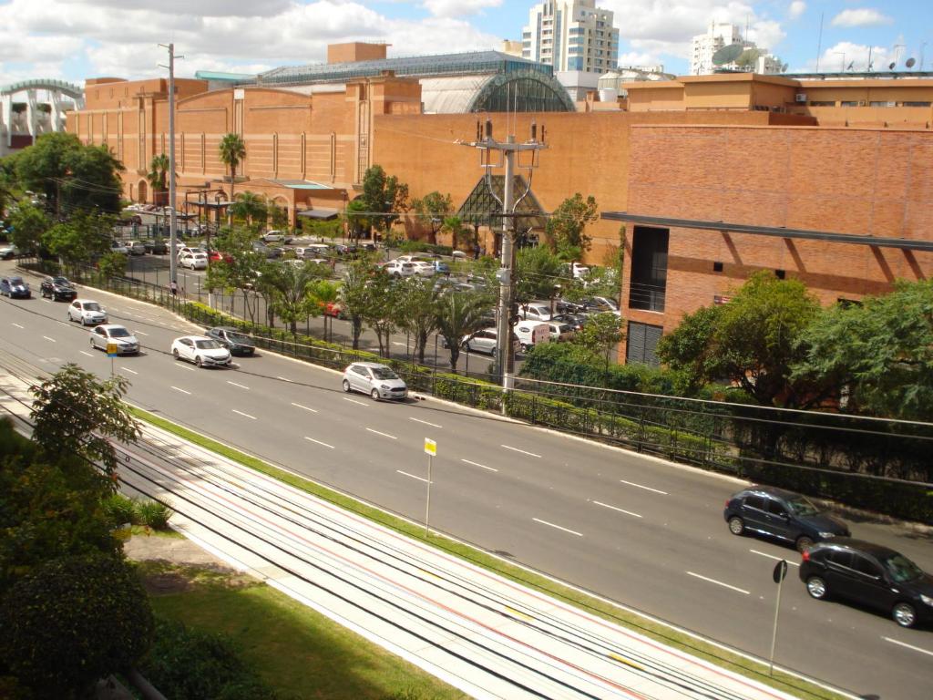 a highway with cars driving on it in a city at Ótimo Apto Shopping Iguatemi in Porto Alegre