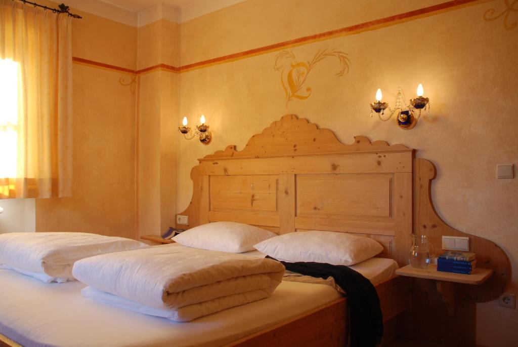 Säng eller sängar i ett rum på Piccolohotel Tempele Residence