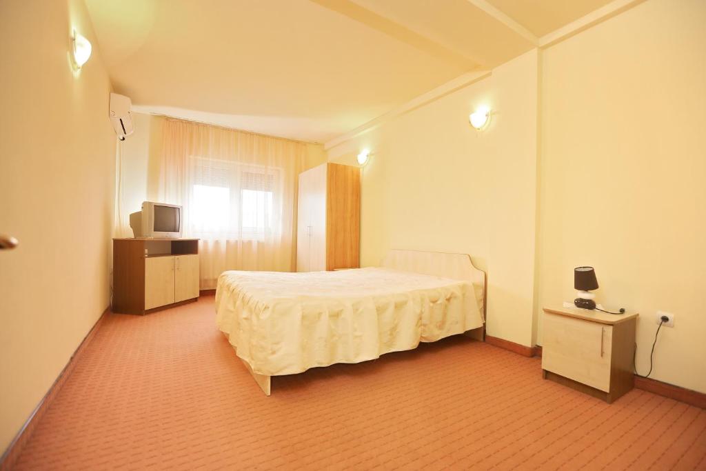 Postel nebo postele na pokoji v ubytování Hotel Class