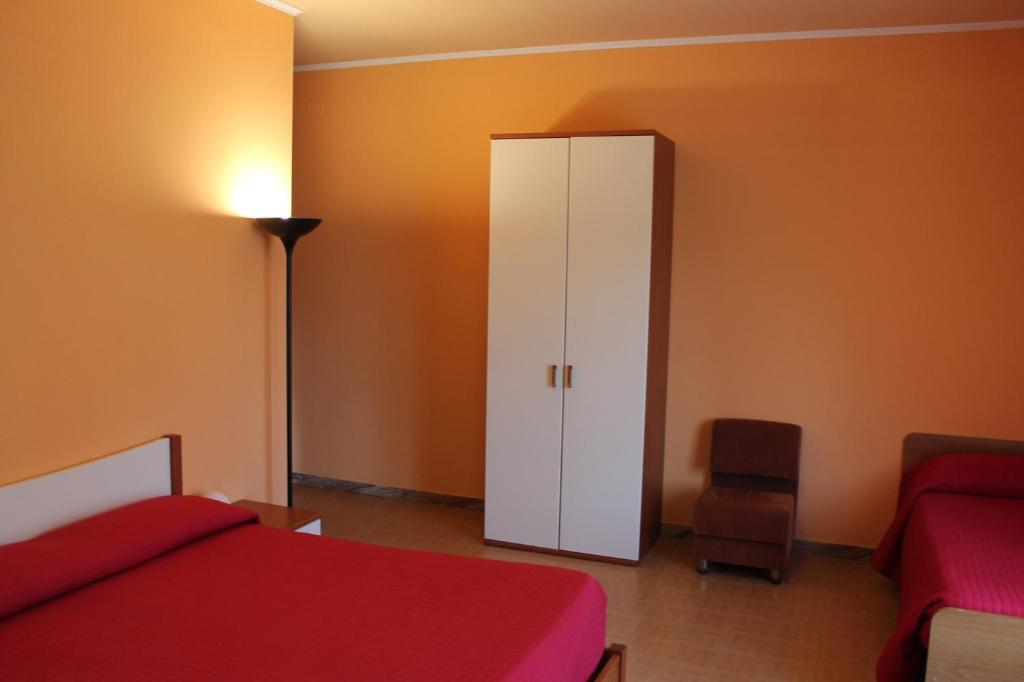 Postel nebo postele na pokoji v ubytování Albergo Paradiso