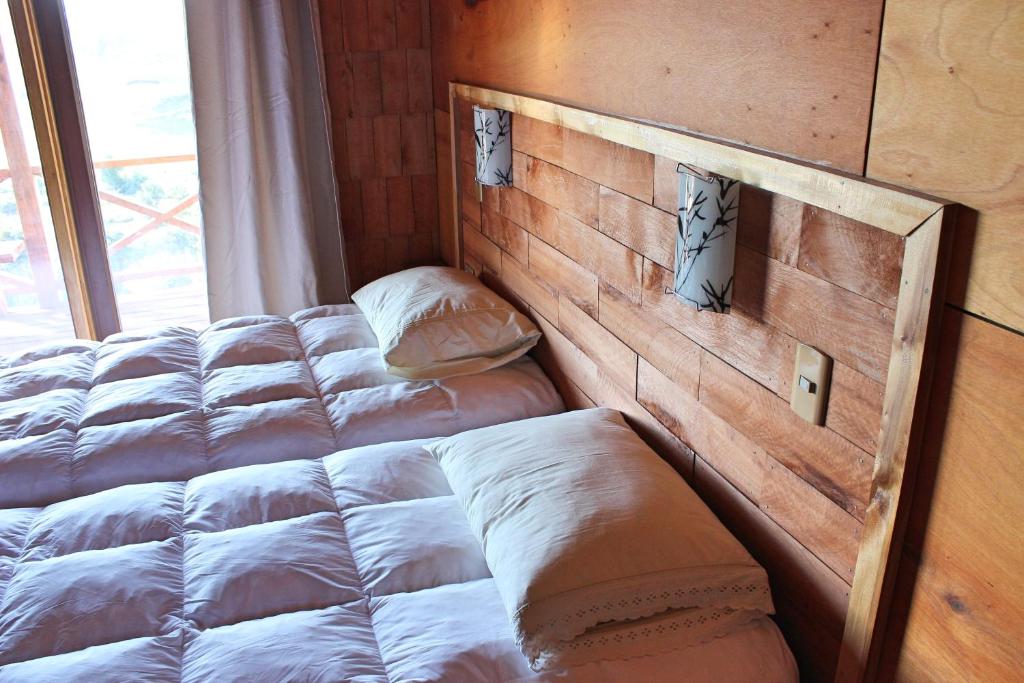 Postel nebo postele na pokoji v ubytování Hostal Boutique Los Arrayanes