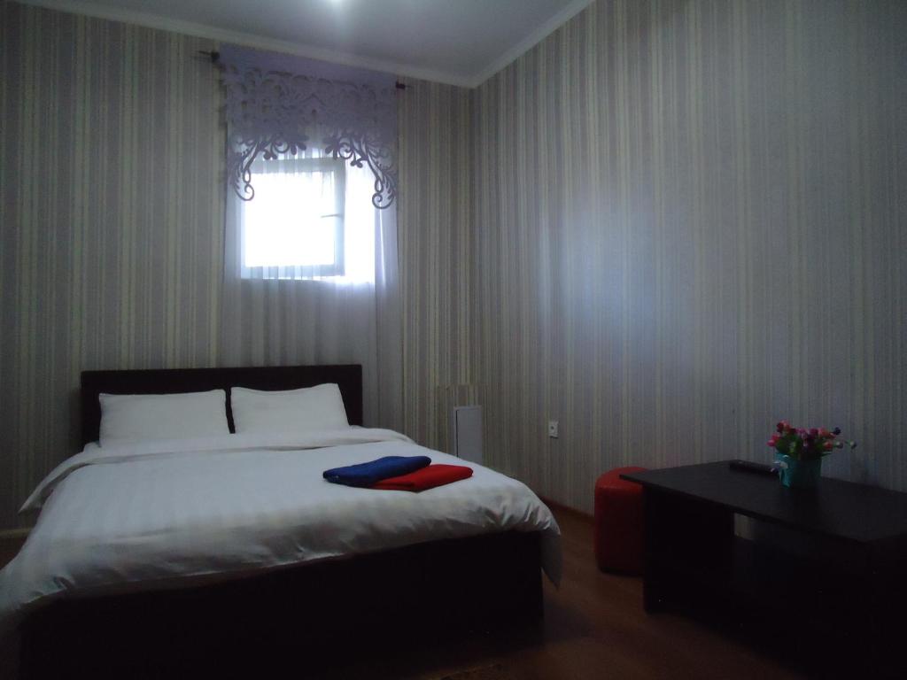 Postel nebo postele na pokoji v ubytování Tumar