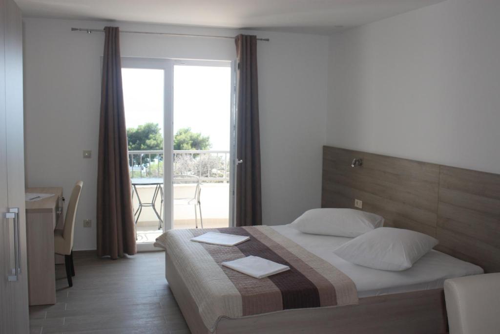 Posteľ alebo postele v izbe v ubytovaní Apartments Bota