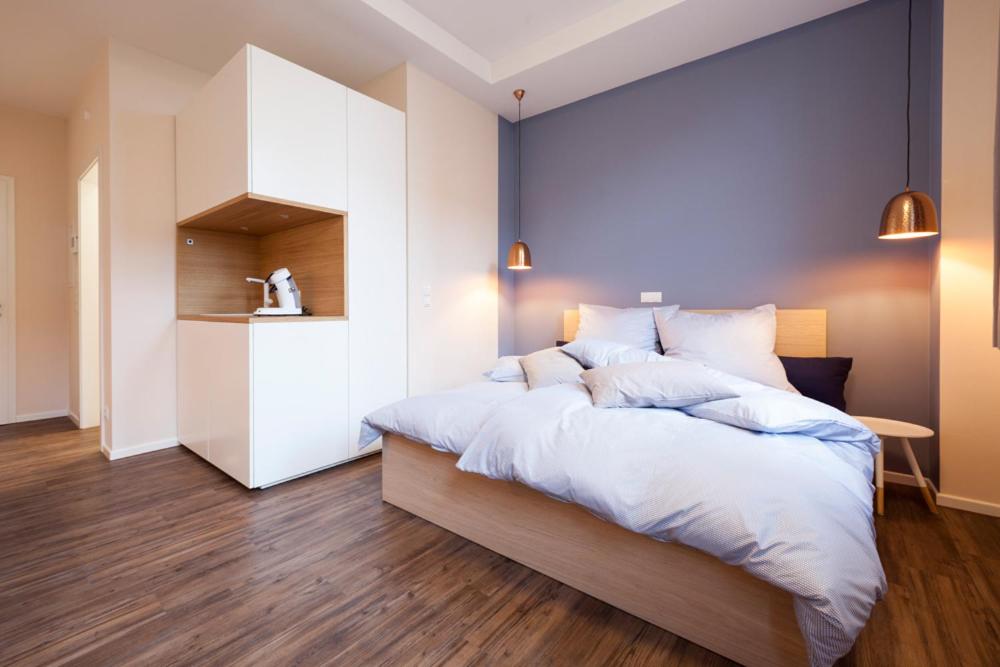 Een bed of bedden in een kamer bij Apartments LUDGERUSHOF