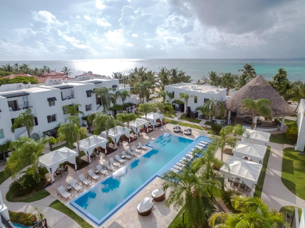 an aerial view of the resort with a swimming pool and the ocean at Las Terrazas Resort in San Pedro