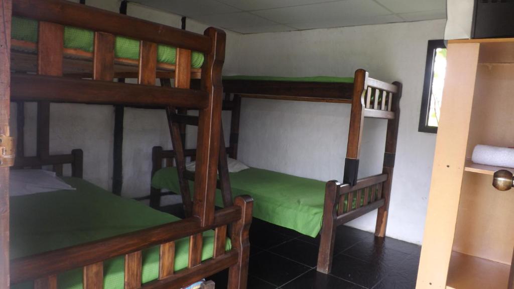 Postel nebo postele na pokoji v ubytování Finca Hotel Paraiso Urrao