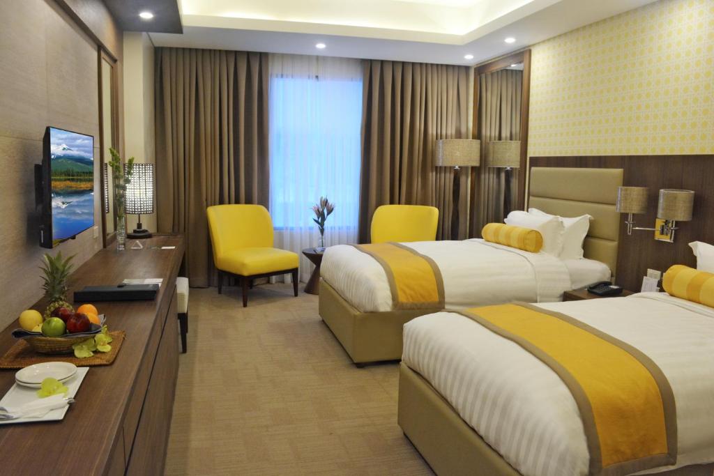 Postel nebo postele na pokoji v ubytování Maayo Hotel