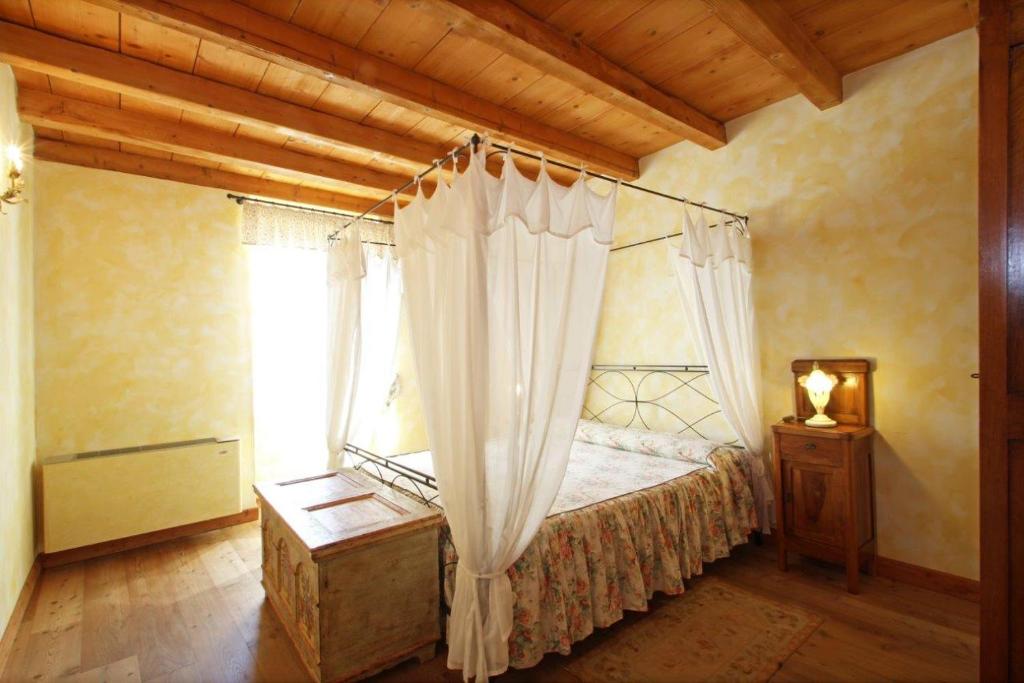 Postel nebo postele na pokoji v ubytování Cascina Le Preseglie