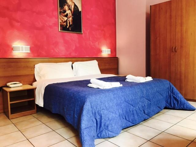 Posteľ alebo postele v izbe v ubytovaní Hotel Pellegrino E Pace