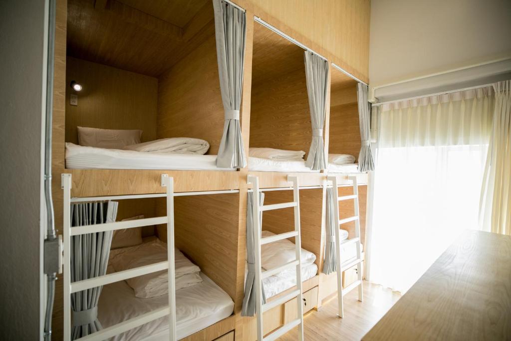 Postel nebo postele na pokoji v ubytování Pakping Hostel