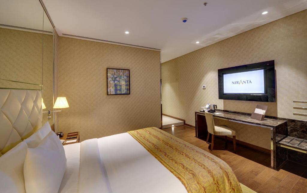Uma cama ou camas num quarto em Niranta Transit Hotel Terminal 2 Arrivals/Landside
