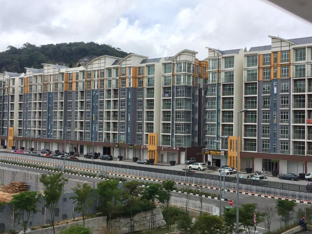 a large apartment building with a road in front of it at Cameron 2Room Square @Golden Hill in Cameron Highlands