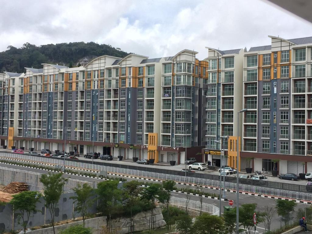 a large apartment building with a road in front of it at Cameron 2Room Square @Golden Hill in Cameron Highlands