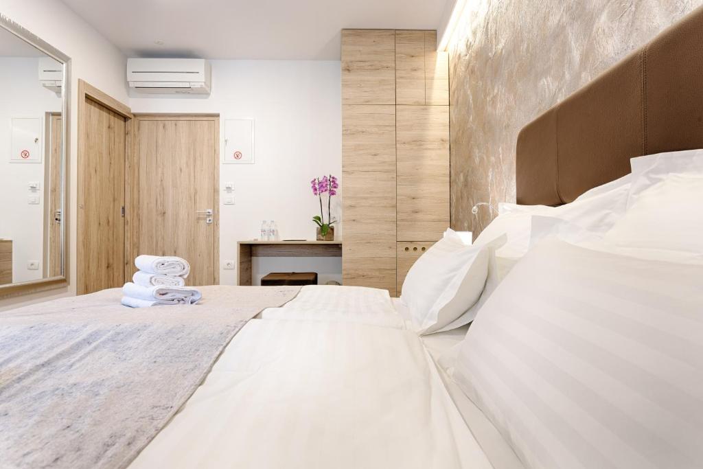 Postel nebo postele na pokoji v ubytování Central Pearl by Nono Ban Rooms