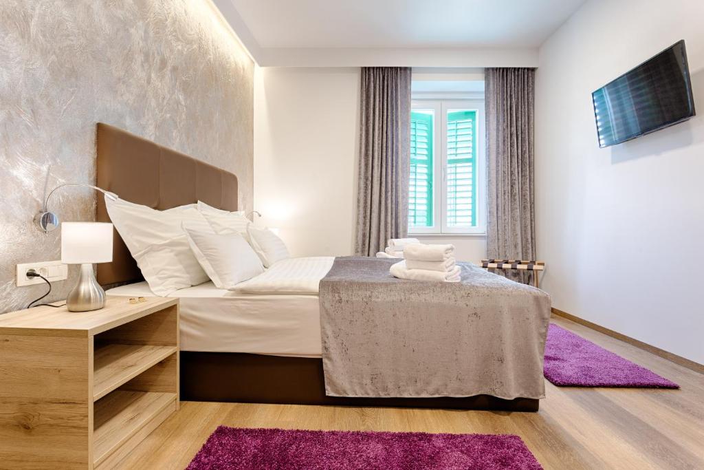 Postel nebo postele na pokoji v ubytování Central Pearl by Nono Ban Rooms