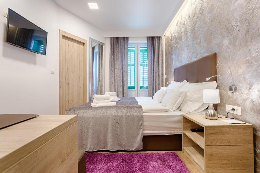 Postel nebo postele na pokoji v ubytování Central Pearl by Nono Ban Rooms