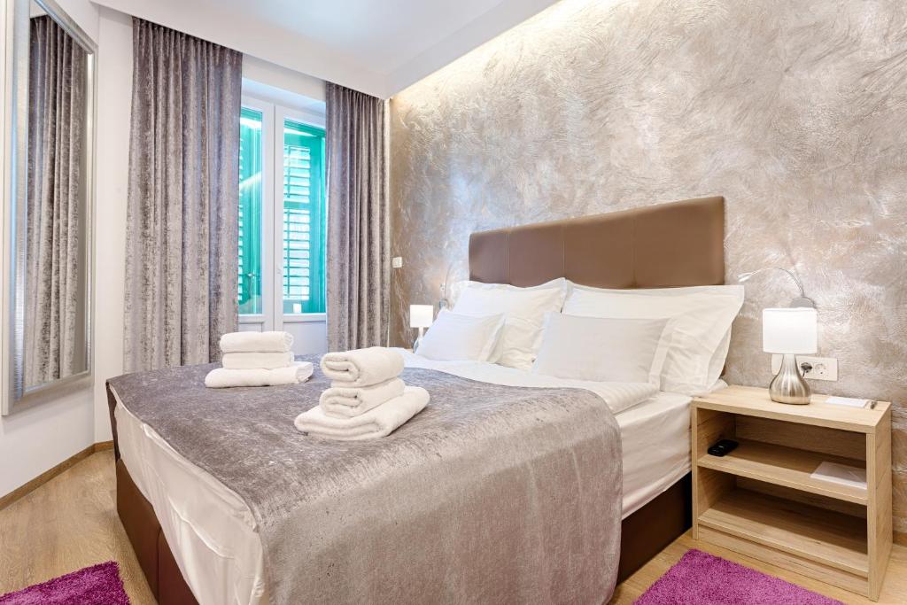 Postel nebo postele na pokoji v ubytování Central Pearl by Nono Ban Rooms