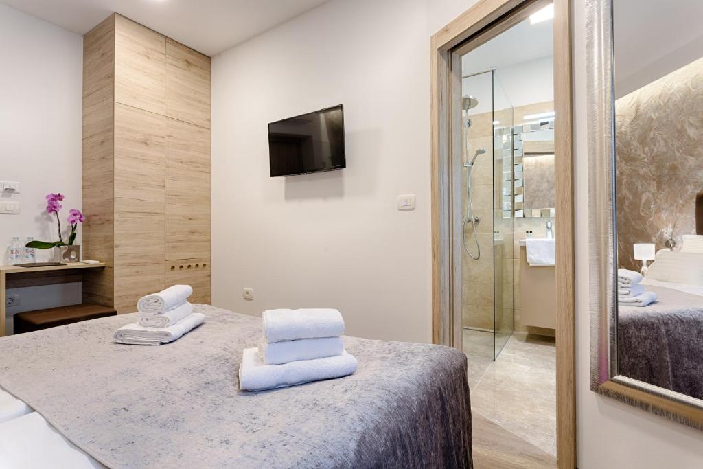 Postel nebo postele na pokoji v ubytování Central Pearl by Nono Ban Rooms
