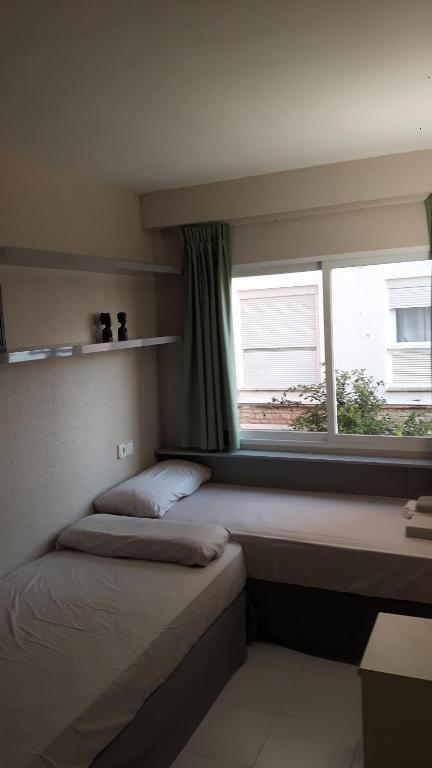 Postel nebo postele na pokoji v ubytování bello-horizonte Salou playa