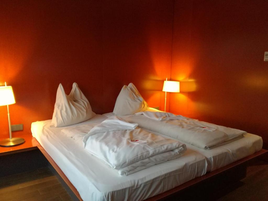 Posteľ alebo postele v izbe v ubytovaní Rosenberger Motor-Hotel Ansfelden