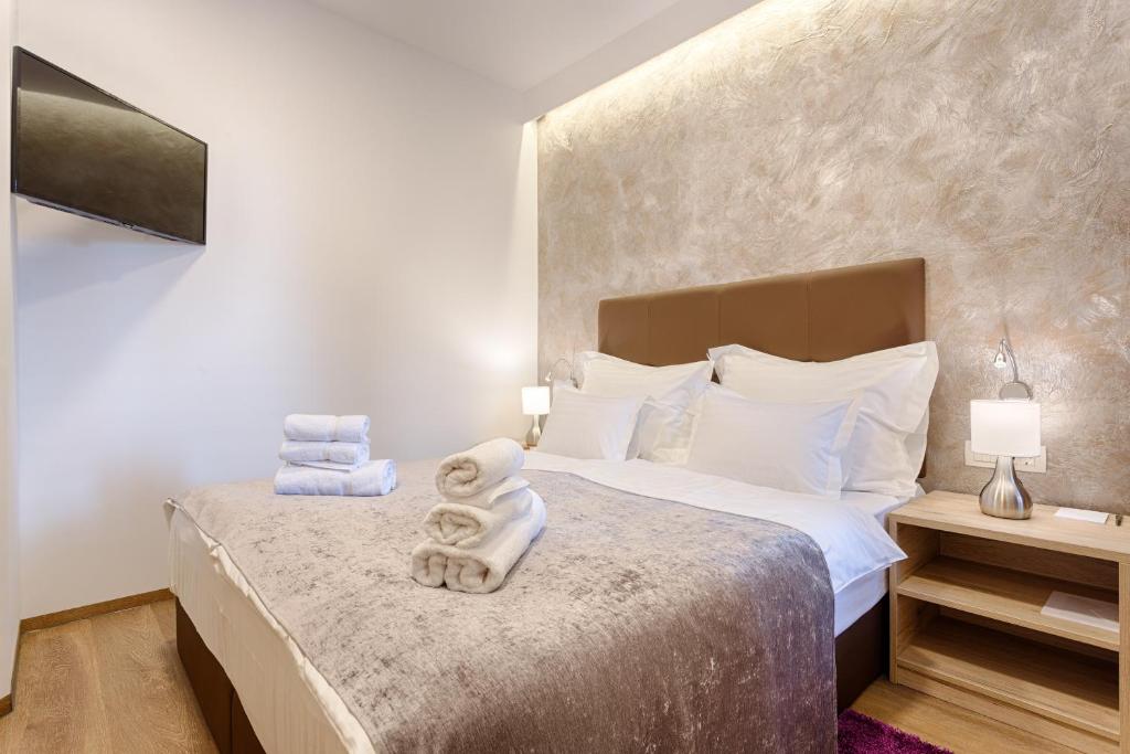 Postel nebo postele na pokoji v ubytování Central Pearl by Nono Ban Rooms