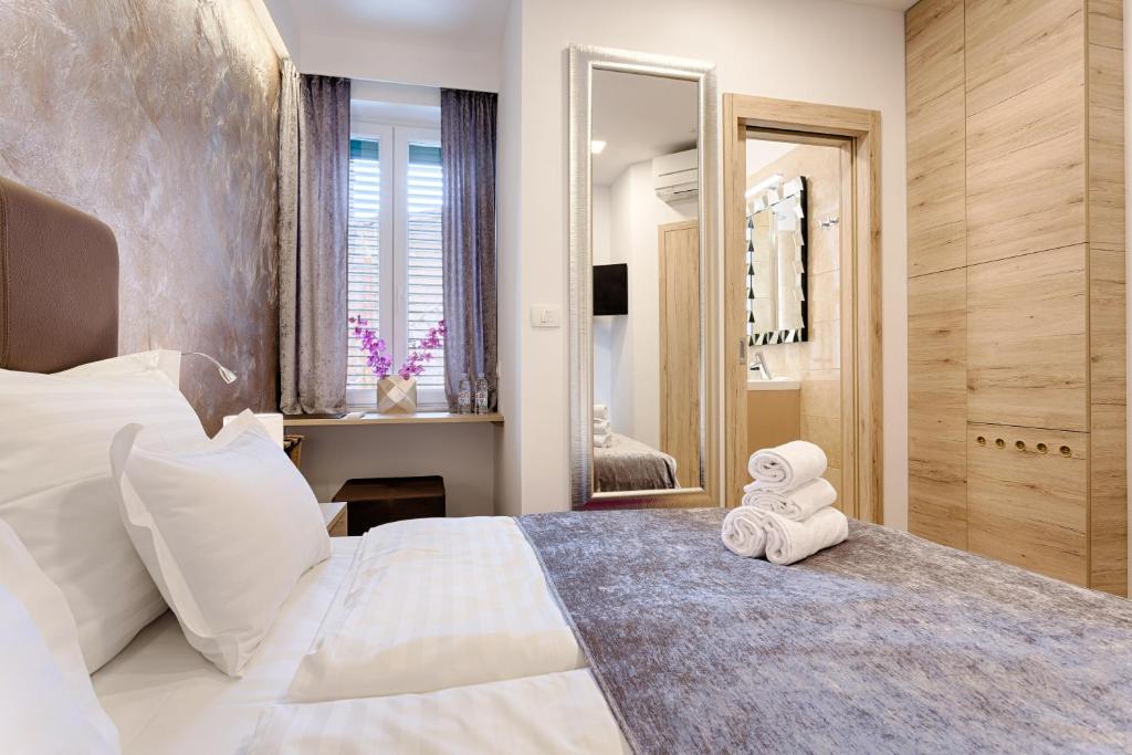 Postel nebo postele na pokoji v ubytování Central Pearl by Nono Ban Rooms