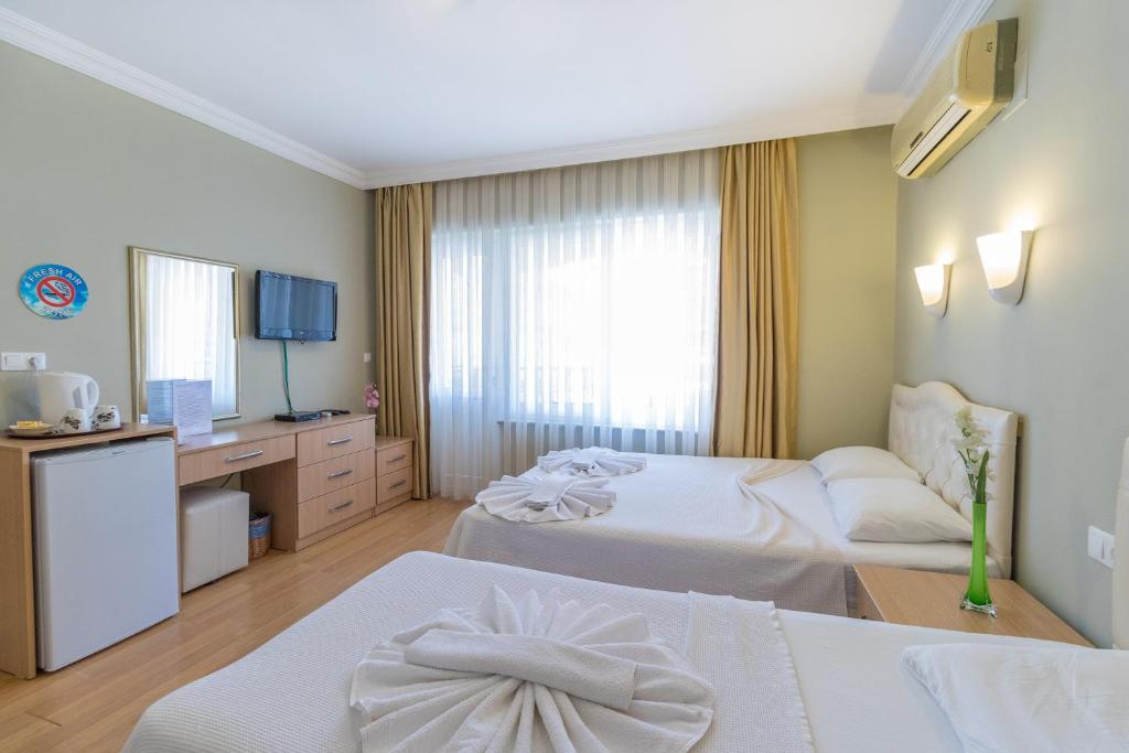 Postel nebo postele na pokoji v ubytování Hotel Dost