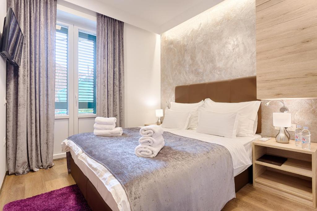 Postel nebo postele na pokoji v ubytování Central Pearl by Nono Ban Rooms