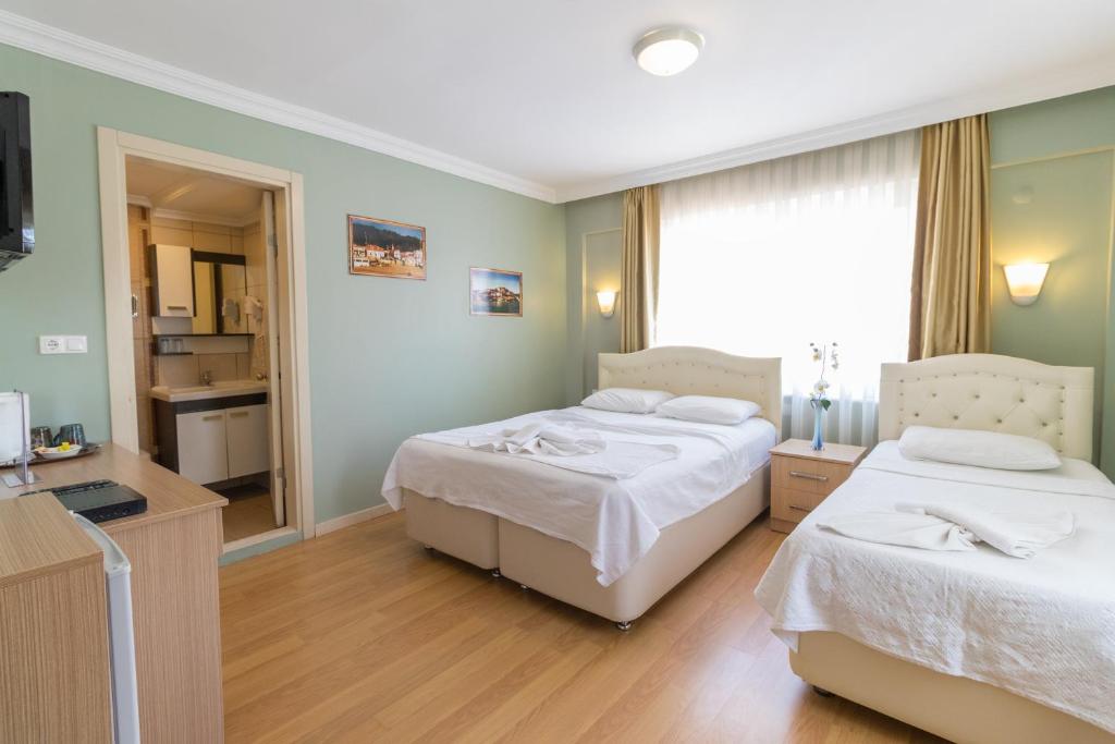 Postel nebo postele na pokoji v ubytování Hotel Dost