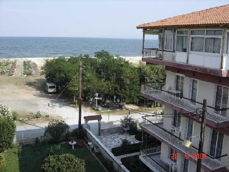 an apartment building with a view of the ocean at Hotel Angela in Asprovalta