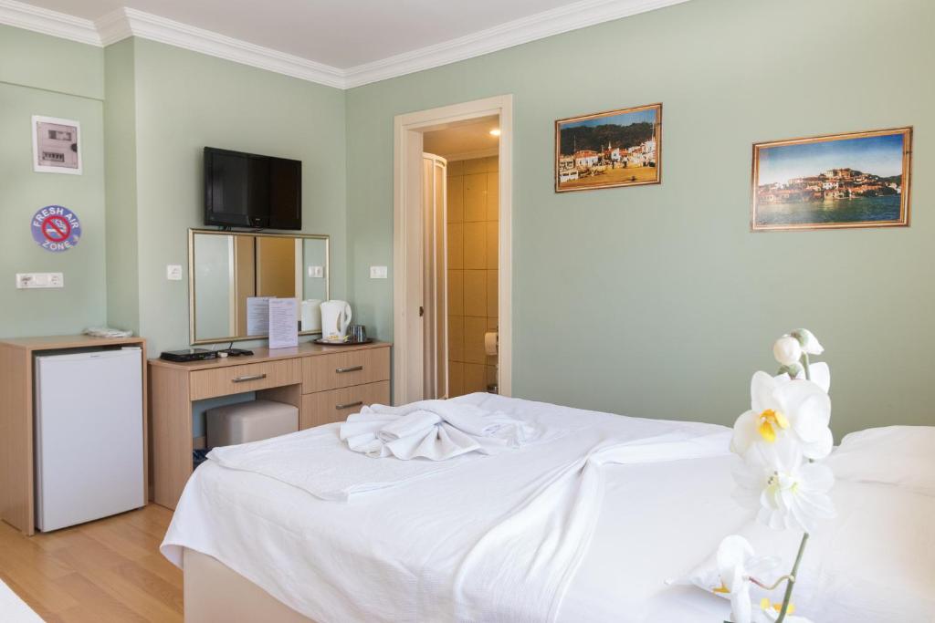Postel nebo postele na pokoji v ubytování Hotel Dost