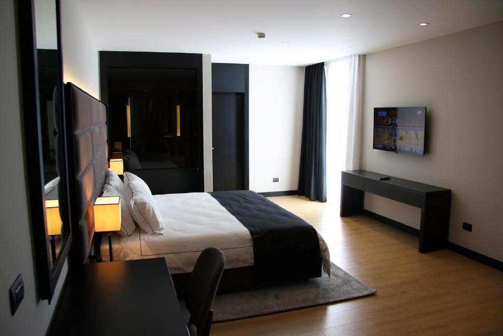 Postel nebo postele na pokoji v ubytování Privilege Hotel & Spa
