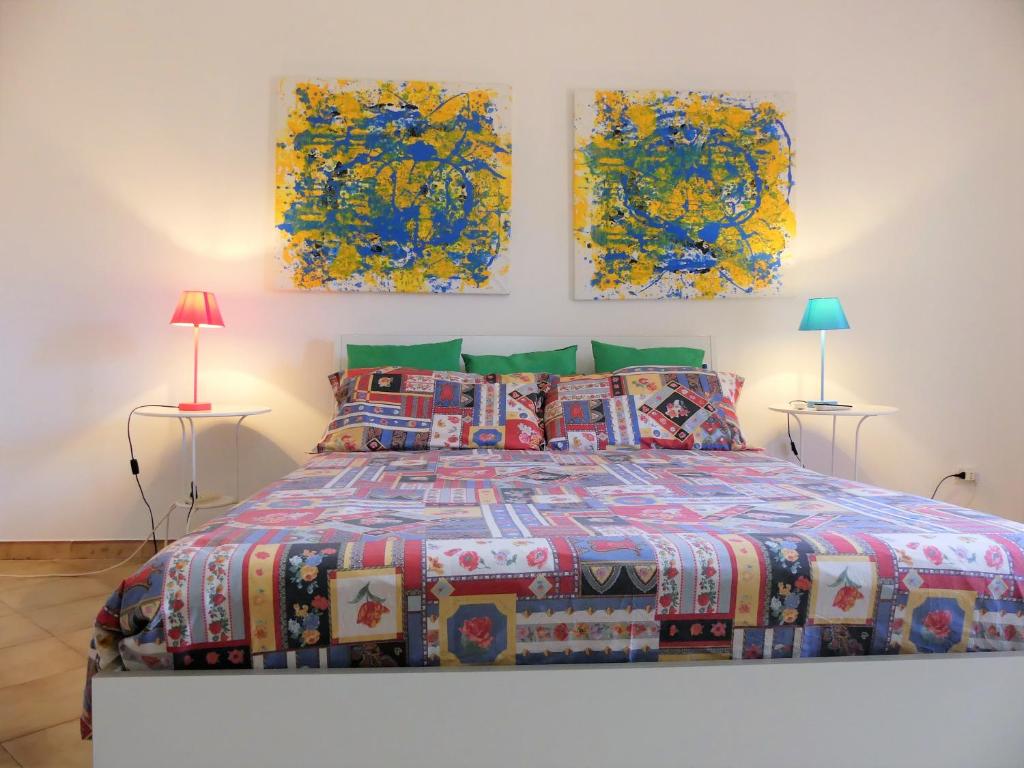 En eller flere senge i et værelse på Holidays Pantanello Solemar