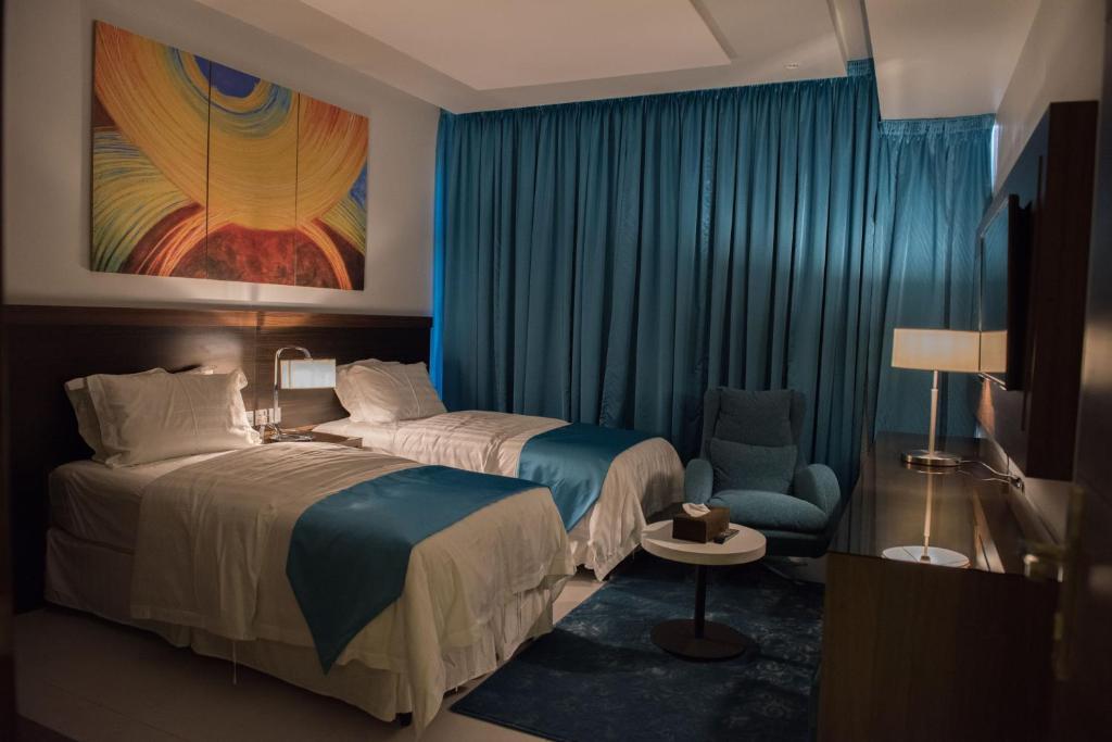 מיטה או מיטות בחדר ב-Velvet Inn Hotel Suites
