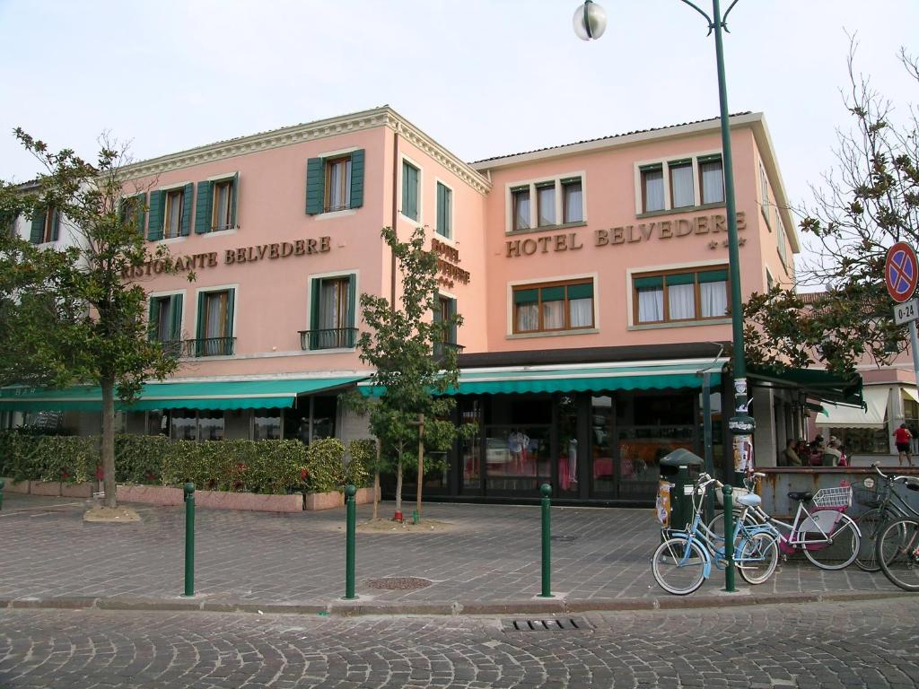 two bikes parked in front of a building at Hotel Belvedere in Venice-Lido