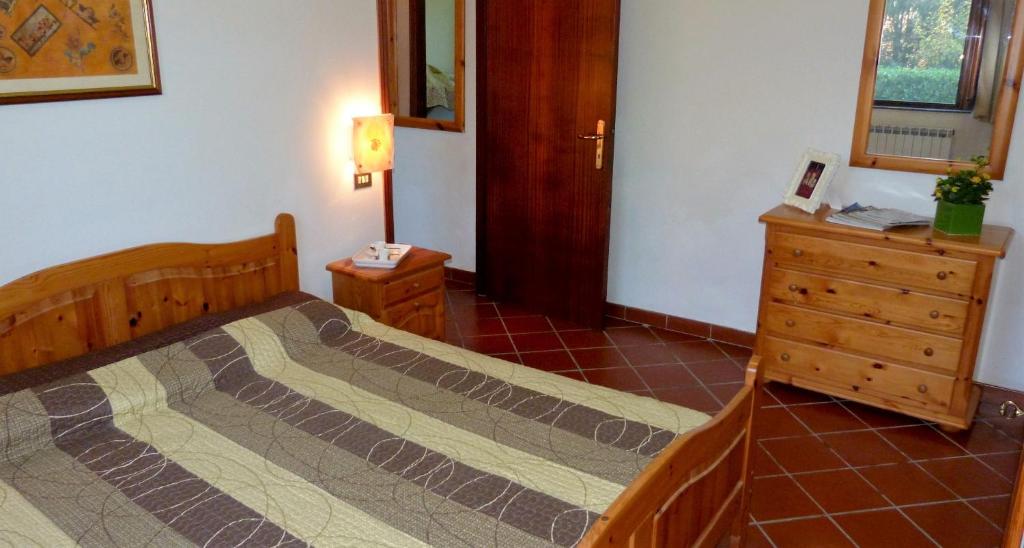 Postel nebo postele na pokoji v ubytování Appartamenti Albarosa by Holiday World