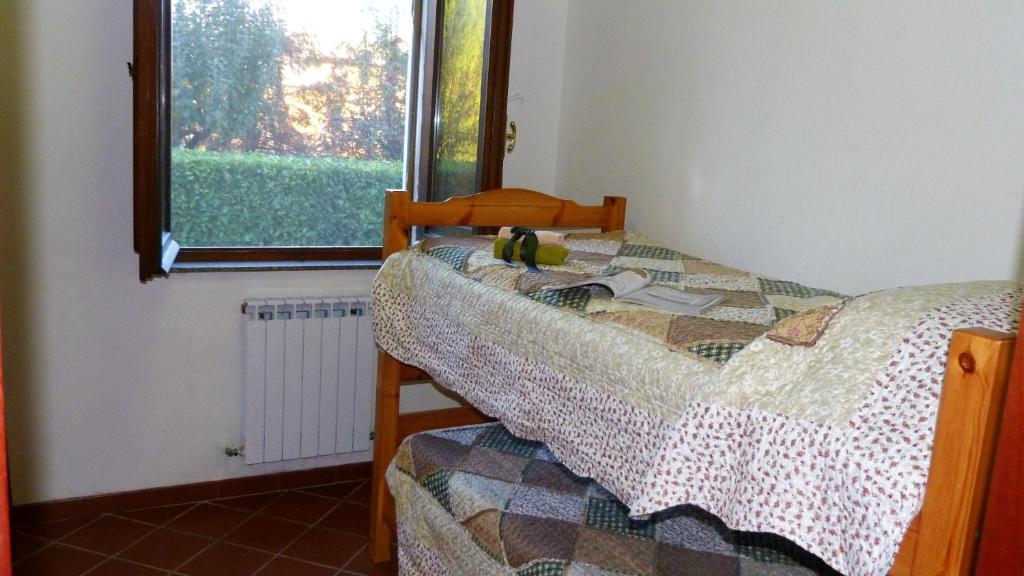 Postel nebo postele na pokoji v ubytování Appartamenti Albarosa by Holiday World