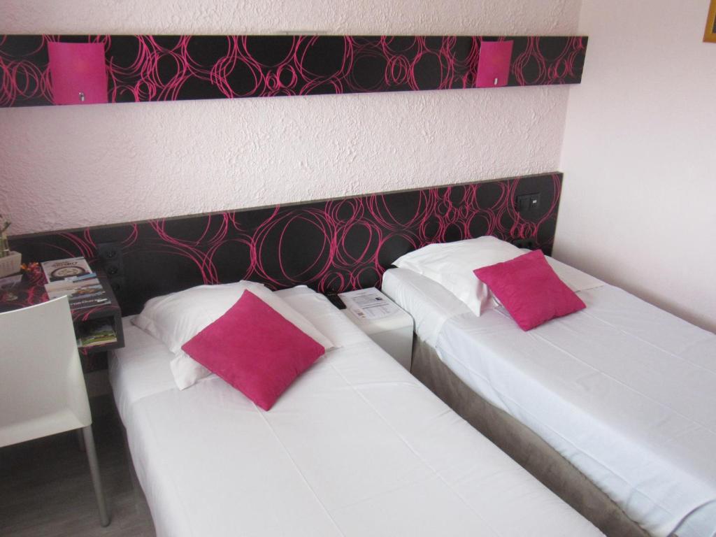 Postel nebo postele na pokoji v ubytování Citotel Les Sternes